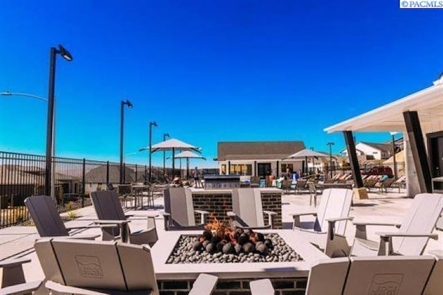 view of patio / terrace featuring a fire pit