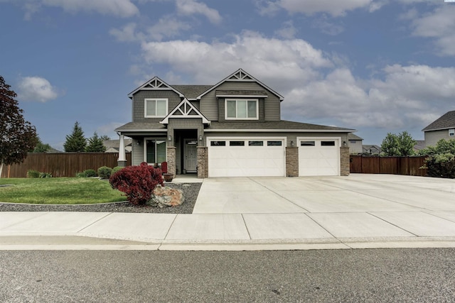 1390 Jade Ave, West Richland, WA 99353 - craftsman-style house with stone siding, concrete driveway, and a garage