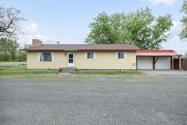 single story home with a garage