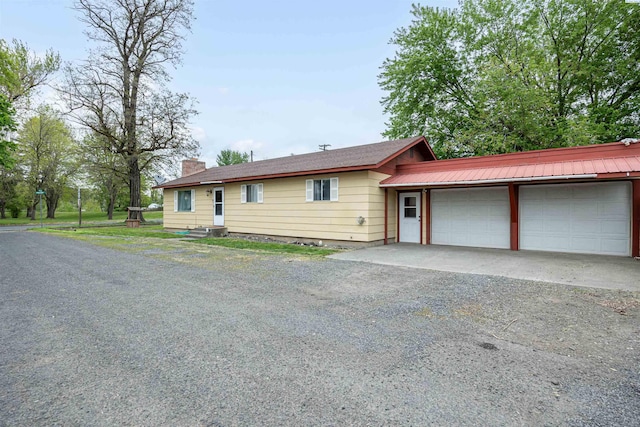 ranch-style house featuring a garage