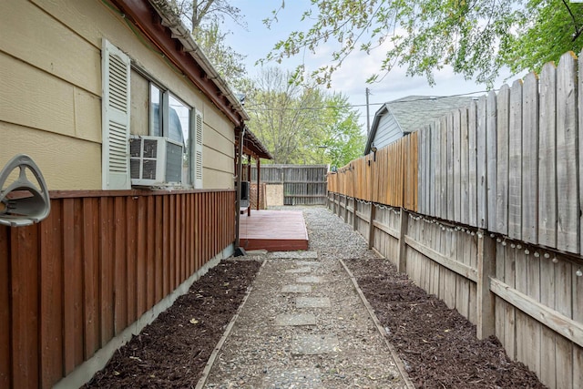 view of side of home with a deck