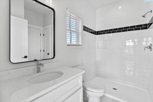 903 Ellen Ln, Zillah, WA 98953 - bathroom featuring vanity, toilet, and tiled shower