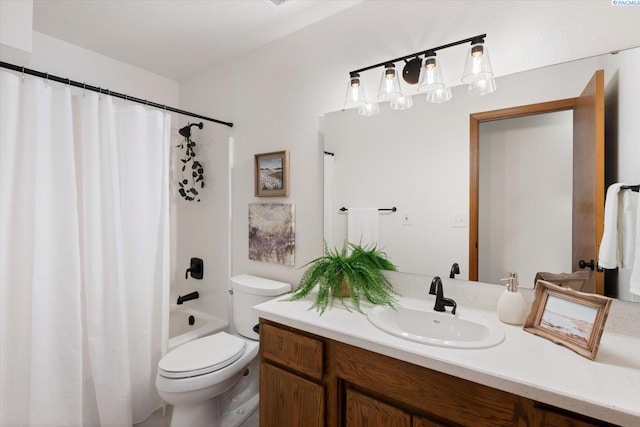 full bath featuring shower / bathtub combination with curtain, vanity, and toilet