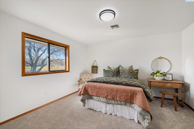 bedroom featuring baseboards, visible vents, and carpet flooring