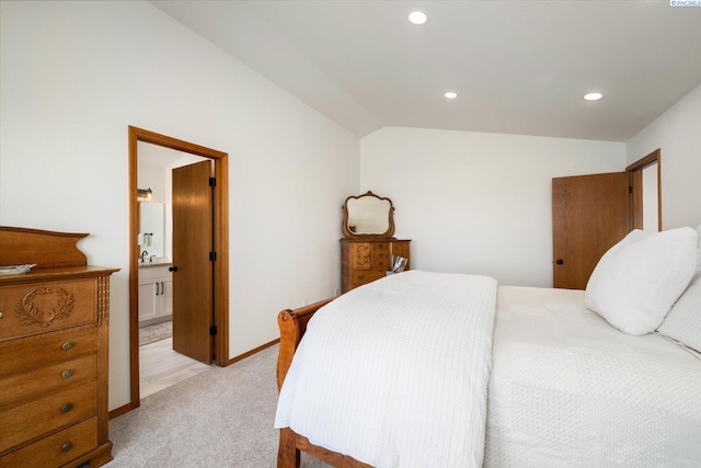 bedroom with recessed lighting, light carpet, connected bathroom, vaulted ceiling, and baseboards