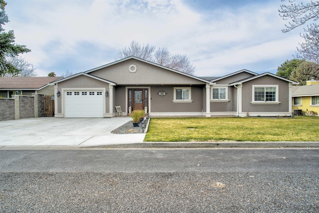 ranch-style home featuring a front lawn, fence, concrete driveway, stucco siding, and an attached garage