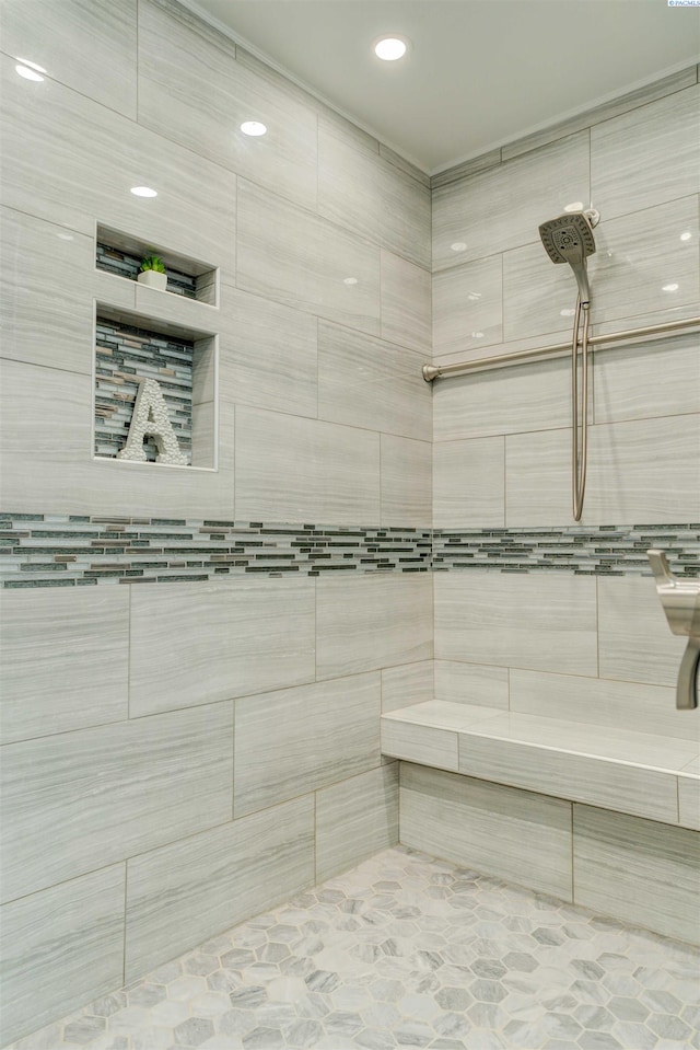 bathroom with a sauna and tiled shower