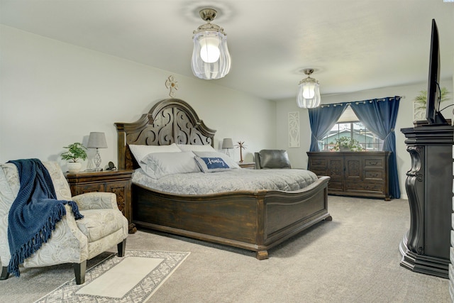 bedroom featuring light carpet