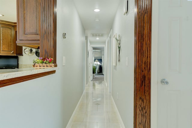 hall featuring light tile patterned floors, visible vents, recessed lighting, and baseboards