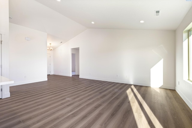 unfurnished living room featuring lofted ceiling, visible vents, baseboards, and dark wood-style flooring