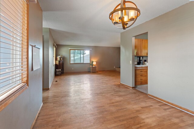 1506 Wilson St, Richland, WA 99354 - unfurnished dining area featuring a chandelier and light wood-style flooring
