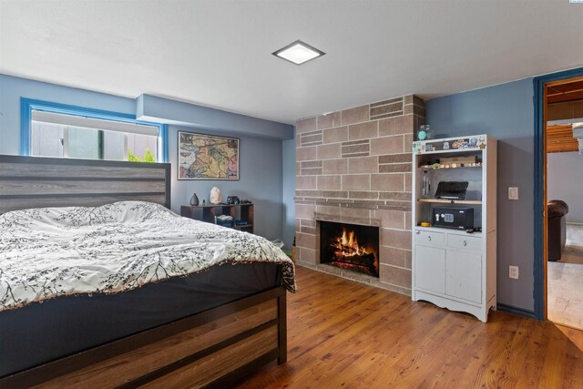 1506 Wilson St, Richland, WA 99354 - bedroom featuring wood finished floors and a fireplace