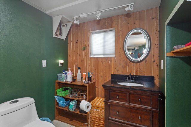 1506 Wilson St, Richland, WA 99354 - bathroom with vanity, wood walls, and track lighting