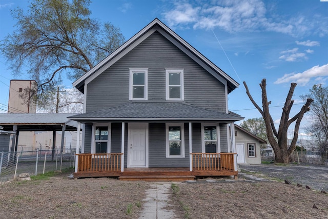 503 Grandridge Ave, Grandview, WA 98930 - view of front facade featuring roof with shingles, covered porch, a carport, and fence