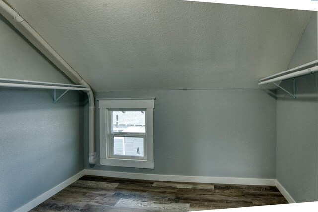 503 Grandridge Ave, Grandview, WA 98930 - walk in closet with dark wood-type flooring and lofted ceiling