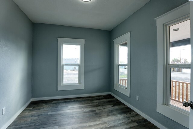 503 Grandridge Ave, Grandview, WA 98930 - empty room featuring baseboards and dark wood-style floors