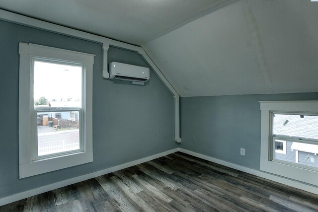 503 Grandridge Ave, Grandview, WA 98930 - bonus room with a wall unit AC, baseboards, lofted ceiling, and a healthy amount of sunlight