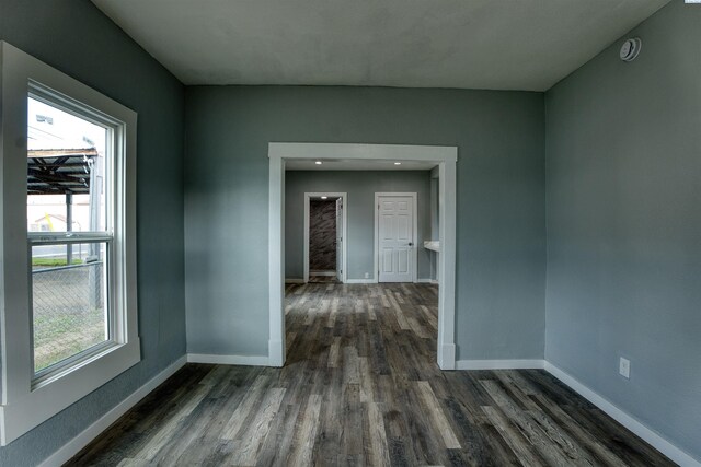 503 Grandridge Ave, Grandview, WA 98930 - unfurnished room with a wealth of natural light, baseboards, and dark wood finished floors