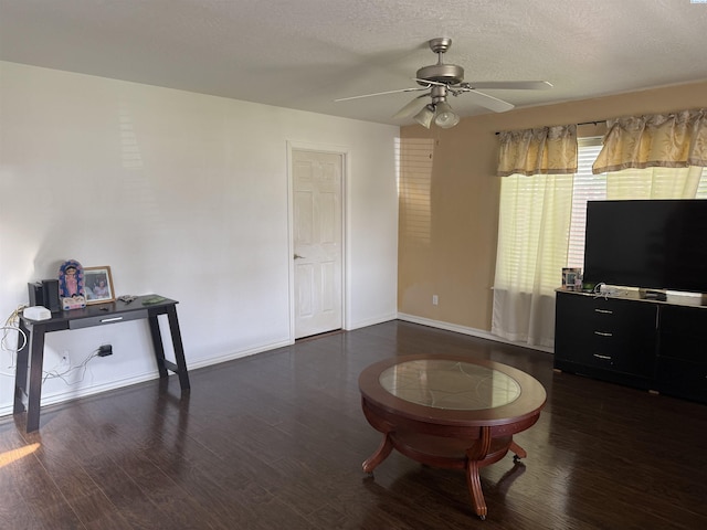 808 N Owen Ave, Pasco, WA 99301 - living area with a ceiling fan, dark wood-type flooring, baseboards, and a textured ceiling