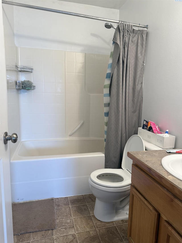 808 N Owen Ave, Pasco, WA 99301 - bathroom with toilet, shower / bathtub combination with curtain, stone finish floors, and vanity