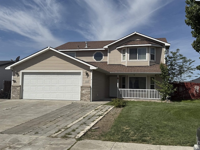 808 N Owen Ave, Pasco, WA 99301 - view of front of property with covered porch, driveway, a garage, brick siding, and roof with shingles