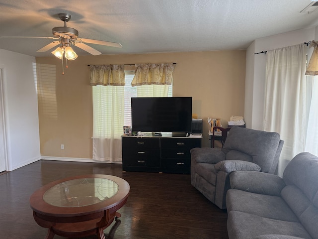 808 N Owen Ave, Pasco, WA 99301 - living room featuring dark wood-type flooring, a ceiling fan, and baseboards