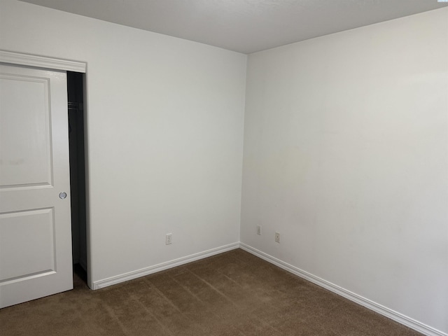 808 N Owen Ave, Pasco, WA 99301 - empty room featuring dark colored carpet and baseboards