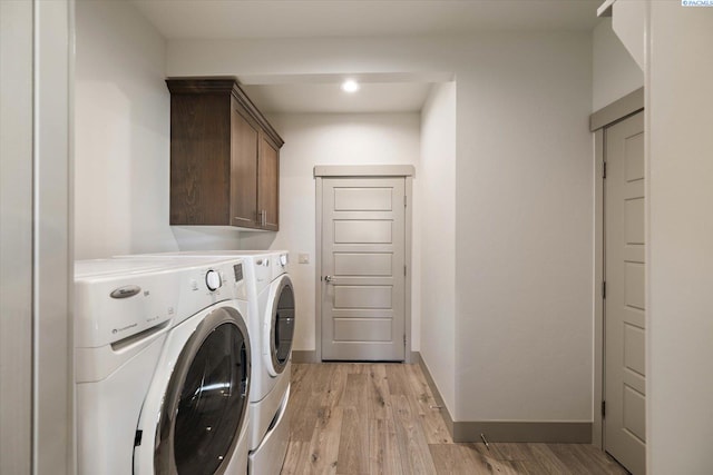 3905 Orchard St, West Richland, WA 99353 - laundry area with washing machine and clothes dryer, light wood-type flooring, cabinet space, baseboards, and recessed lighting