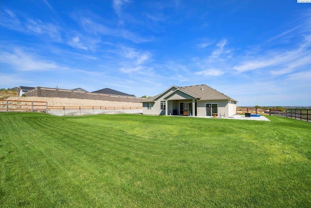 3905 Orchard St, West Richland, WA 99353 - back of house featuring a patio area and stucco siding