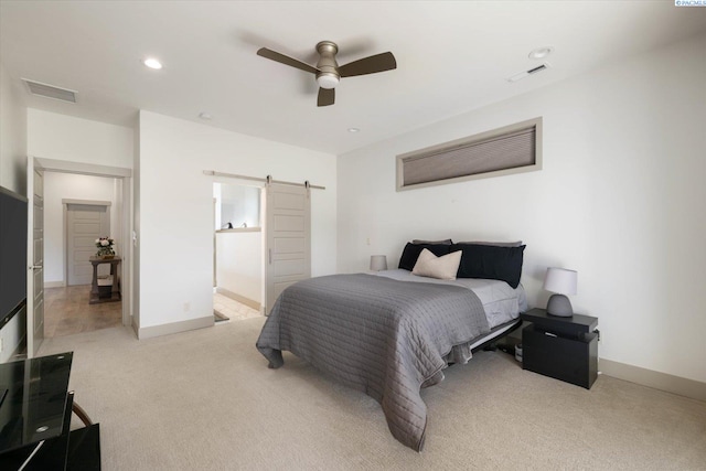 3905 Orchard St, West Richland, WA 99353 - bedroom with a barn door, carpet, ceiling fan, baseboards, and ensuite bathroom