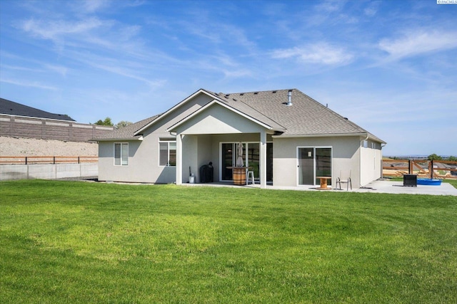 3905 Orchard St, West Richland, WA 99353 - back of house featuring stucco siding, a patio area, and roof with shingles