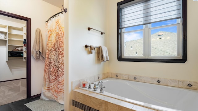 full bath with a garden tub, tile patterned floors, and a shower with shower curtain