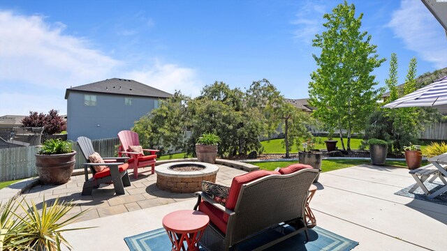view of patio / terrace featuring an outdoor fire pit