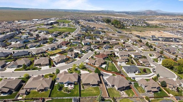 birds eye view of property with a residential view and a mountain view