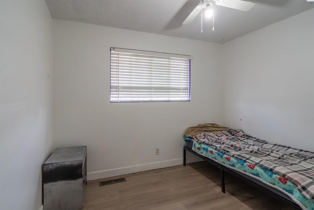 775 S 4th Ave, Othello, WA 99344 - bedroom with wood finished floors, baseboards, and ceiling fan