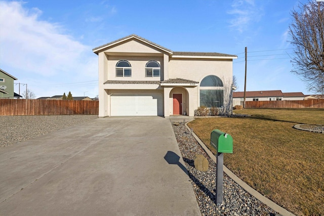 view of front of property with a garage and a front yard