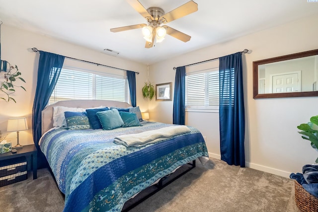 carpeted bedroom featuring visible vents, ceiling fan, and baseboards