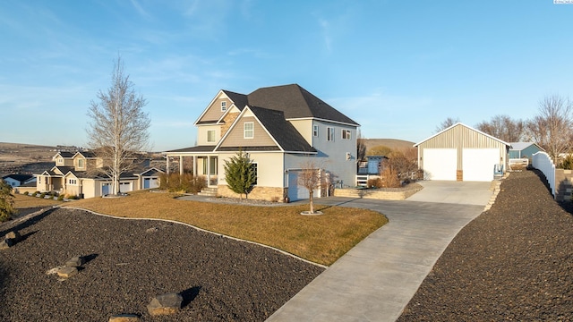 view of front of house featuring a garage and an outdoor structure