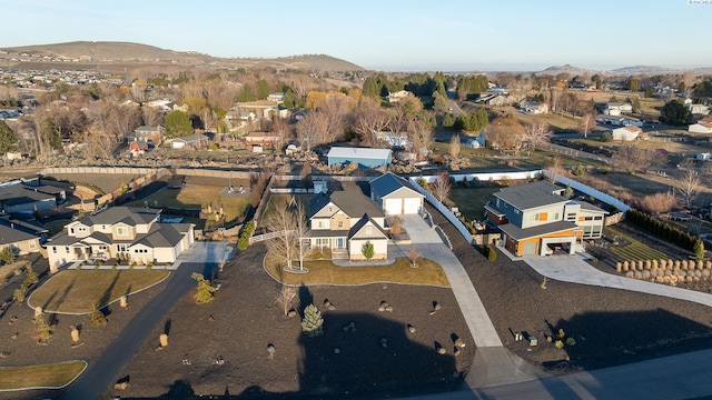 drone / aerial view featuring a residential view and a mountain view