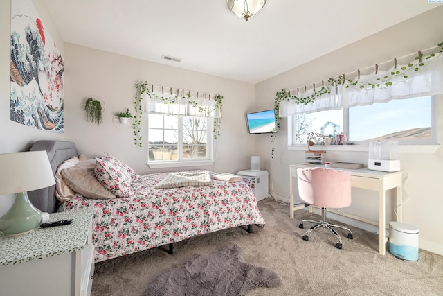 bedroom featuring carpet floors and visible vents