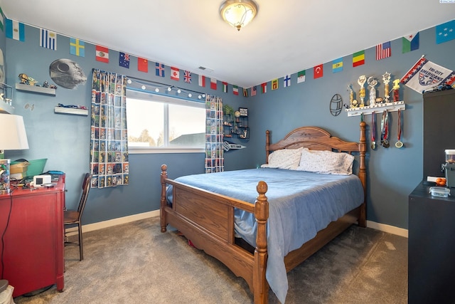 bedroom with carpet floors, visible vents, and baseboards