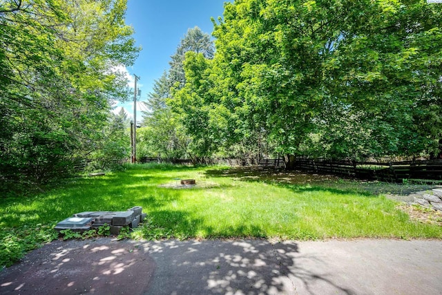 1315 NW Haven Cir, Pullman, WA 99163 - fenced backyard with an outdoor fire pit