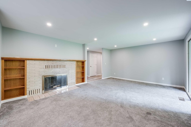 1315 NW Haven Cir, Pullman, WA 99163 - unfurnished living room featuring carpet flooring, recessed lighting, baseboards, a fireplace, and built in features
