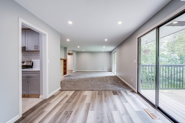 1315 NW Haven Cir, Pullman, WA 99163 - spare room with light wood-type flooring, healthy amount of natural light, baseboards, and recessed lighting