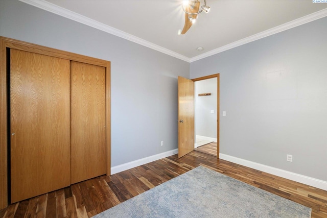 521 Eastgate Dr, Prosser, WA 99350 - unfurnished bedroom featuring baseboards, wood finished floors, ornamental molding, and a closet