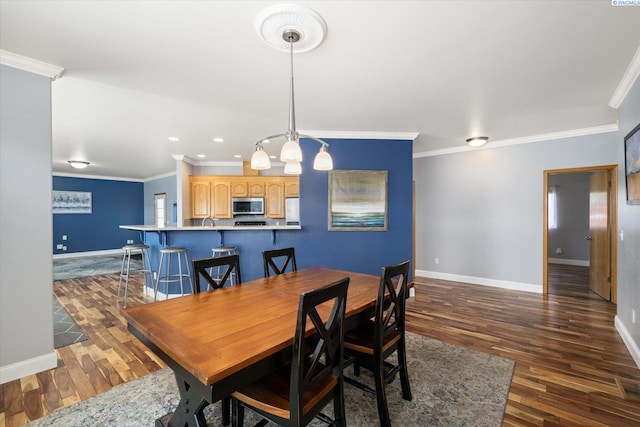 521 Eastgate Dr, Prosser, WA 99350 - dining space with baseboards, dark wood-style floors, ornamental molding, and recessed lighting