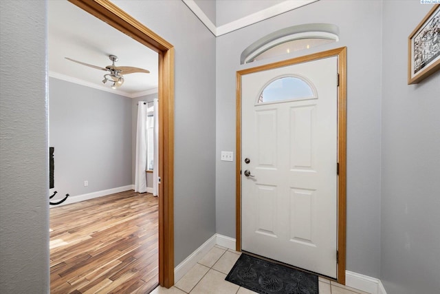 521 Eastgate Dr, Prosser, WA 99350 - foyer entrance featuring ornamental molding, ceiling fan, baseboards, and light wood-style floors