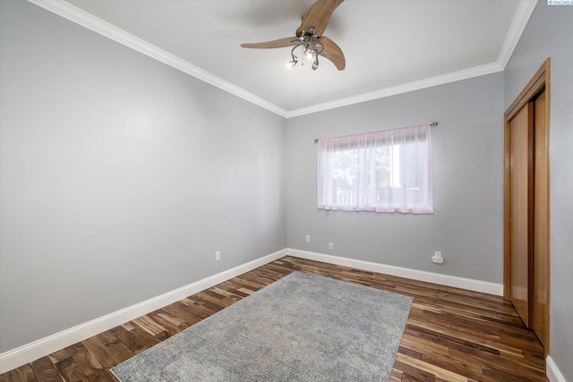521 Eastgate Dr, Prosser, WA 99350 - unfurnished bedroom featuring crown molding, dark wood finished floors, baseboards, a closet, and a ceiling fan
