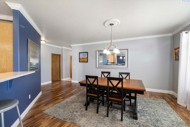 521 Eastgate Dr, Prosser, WA 99350 - dining area featuring wood finished floors, crown molding, and baseboards