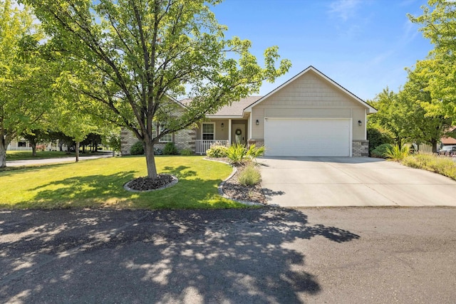 view of front of home featuring a garage and a front lawn